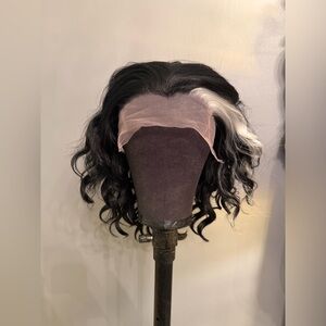 Brand new 13 x 3 black synthetic wavy wig with white streak. 14 inches